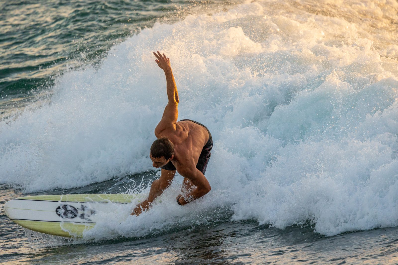 Surfing at golden hour